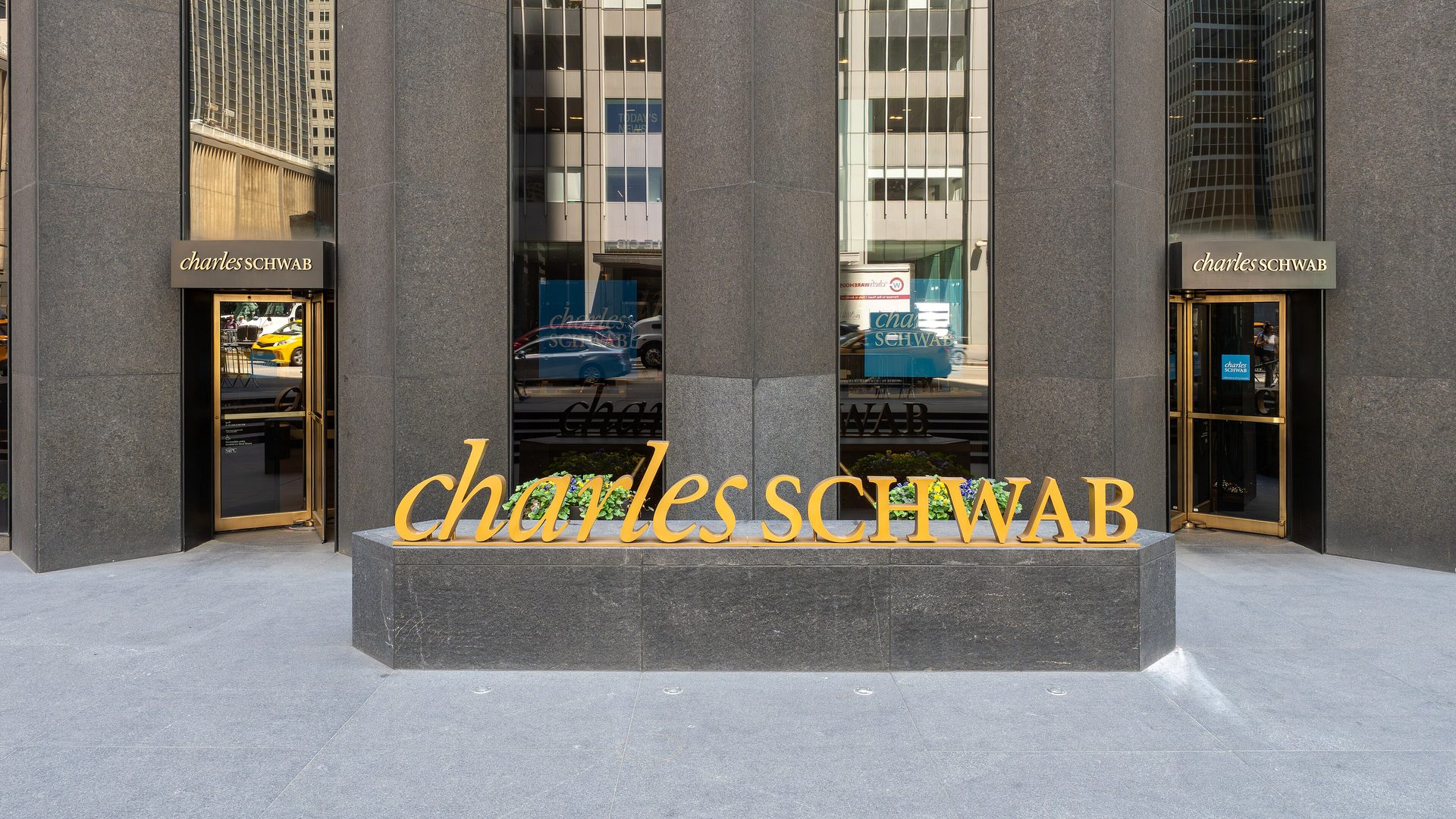 Claude for Financial Advisors connects custodians like Charles Schwab, whose New York headquarters signage is shown here