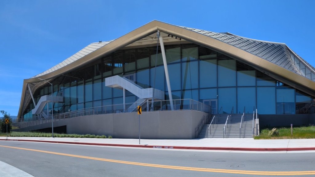 Google Labs CC family AI agent: the Google Bay View campus in Mountain View under a clear sky