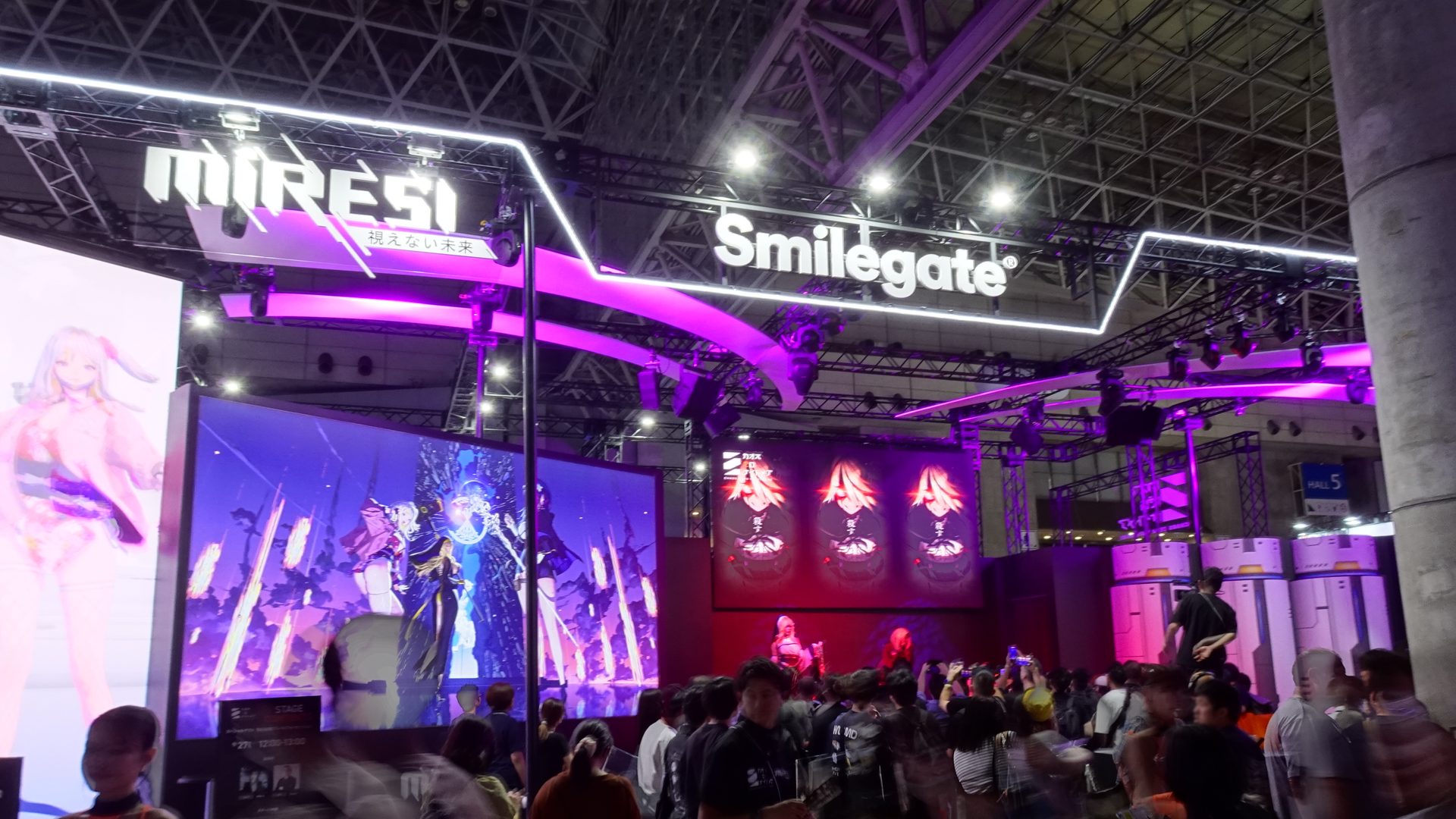 Japanese game developers generative AI: crowded Tokyo Game Show hall with lit game booths and big screens