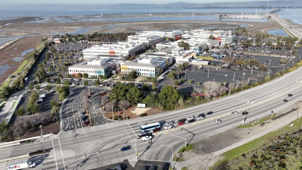 meta muse ai agent: aerial view of Meta's Menlo Park headquarters campus with the Meta sign at the entrance