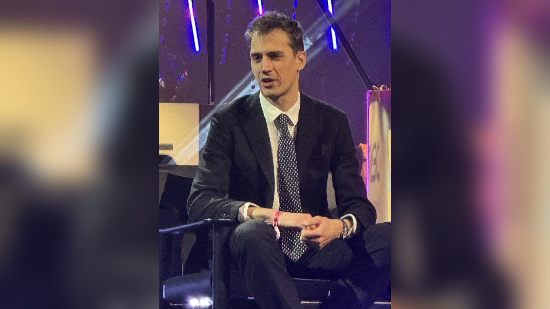 Mistral AI funding round: chief executive Arthur Mensch speaking on stage at a technology conference