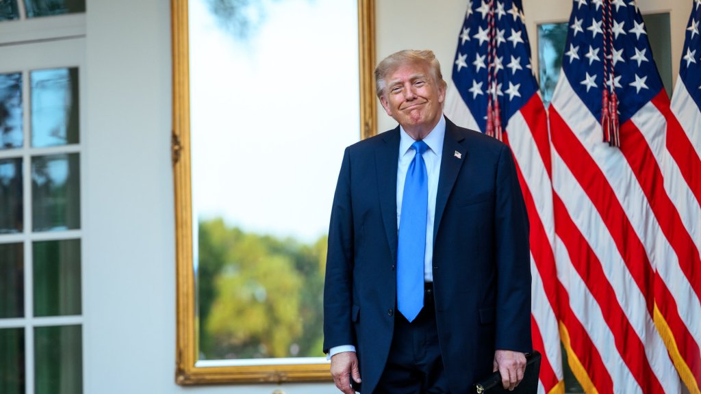 trump ai images: Donald Trump in a navy suit in front of US flags at the White House