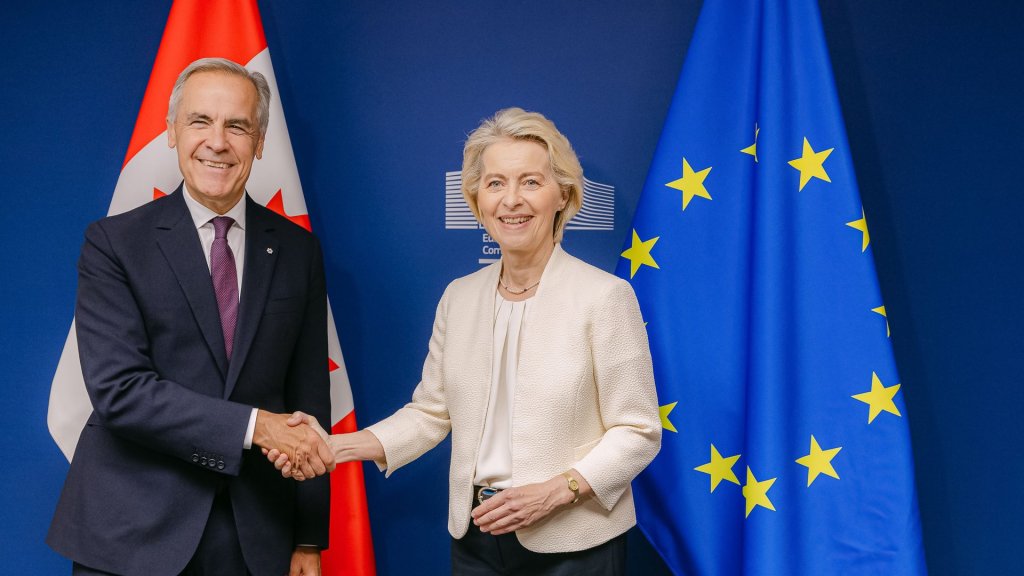 canada eu ai infrastructure contracts: Mark Carney and Ursula von der Leyen shake hands in front of Canadian and EU flags