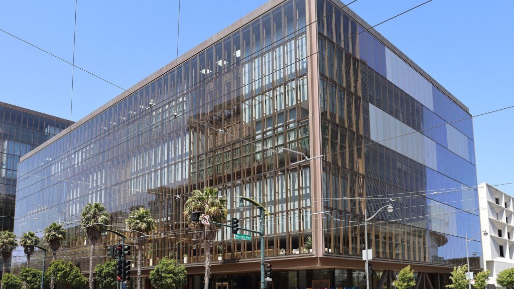 open ai math release: the glass OpenAI headquarters building at 1515 Third Street in San Francisco