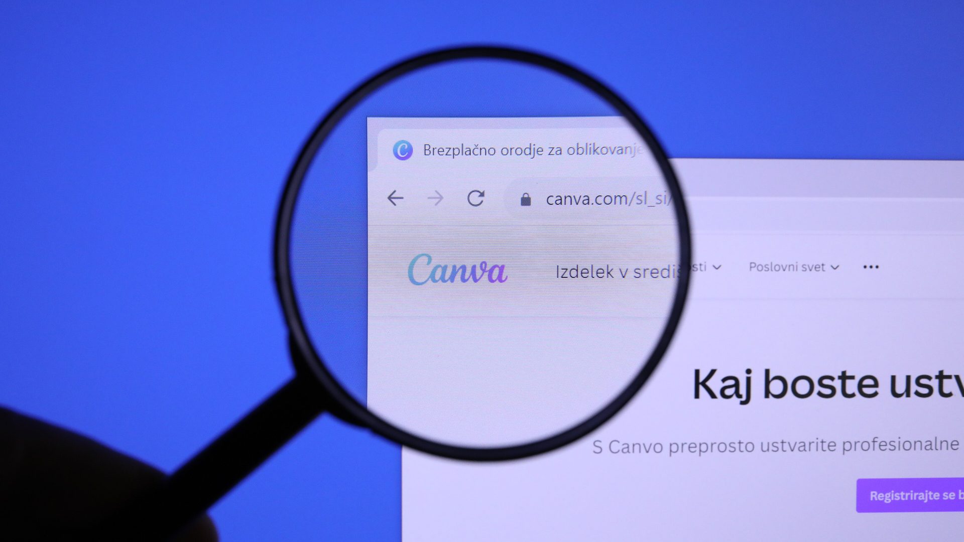 rhiannon morgan ai photo criticism: magnifying glass over the Canva logo on the company website
