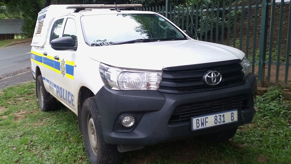 saps ai police badge warning: a South African Police Service patrol vehicle with the police badge on its door