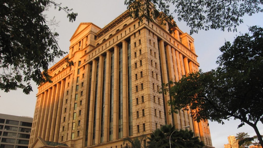 zetrix ai financial troubles malaysia: the Bursa Malaysia exchange building in Kuala Lumpur at sunset